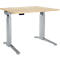 Height-adjustable desk with light wood top and silver frame.