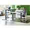 Two height-adjustable desks in a modern office. A laptop sits on the table. Ergonomic office chair.