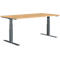 A height-adjustable desk with a light brown tabletop and grey metal legs.