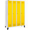 Yellow lockers with white frame. Four doors, each with a handle. Hole pattern at the top and bottom.