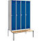 Locker with four blue doors and a wooden bench.