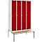 Locker with four red doors, white frame, and a bench.