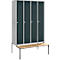 A grey metal locker with four doors and a wooden bench. The doors have ventilation slots and silver handles.