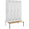 White lockers with wooden bench. Four lockers with keys and ventilation slots.