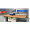 Wooden workbench with tools and accessories; drill, screws, drill bits. Tool wall.