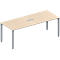 A rectangular, beige conference table with silver legs. There is a silver recess on the table top.