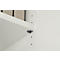 Close-up of a white shelf board with grey bracket. Below a white wall with pre-drilled holes.