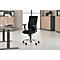 Black office chair in front of light walls. The chair has a mesh back, armrests and a silver frame.