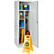 Open cabinet with cleaning supplies and a warning sign about slippery floors.