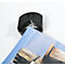 Black plastic corner rounder cutting off a printed sheet of paper. The background is white.
