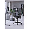 Office chair in front of a gray background. Desk, screen, plants, windows and shelves in the background. Light gray floor.