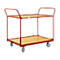 A two-tiered red serving cart with wooden shelves, equipped with wheels.