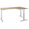 Corner desk, light wood, gray adjustable legs. Curved corner, modern design.