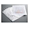Transparent sheet protectors, some with holes, lie on a gray background. One sheet contains a chart.