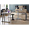 Office with height-adjustable desks, office chair, and mobile pedestal.