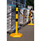 Yellow and black bollards with chain block access to packaged goods.