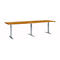 A rectangular, height-adjustable desk with a light brown tabletop and silver legs. Ideal for office work.