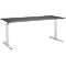 Grey desk with white legs, photographed in perspective from the front.