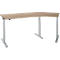 An L-shaped desk with a light brown tabletop and height-adjustable, gray legs, against a white background.