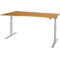 A height-adjustable desk in light wood design with silver legs. The desk has a curved edge.