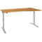 Light, height-adjustable desk with a light brown tabletop and silver legs. Rounded edge. For ergonomic working.