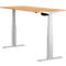 A height-adjustable desk with a light wood top and white legs. A control is attached under the tabletop.