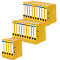 Yellow folders stacked. White labels can be seen on the front.