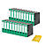 Green file folders, next to a stack of paper. Good overview and order in the office.