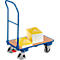 Blue transport cart with stacks of paper. Cart with wooden top and wheels. Paper with a yellow surface is on the top.