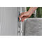 Hand opening a door handle. The door has vertical slats, the handle is silver, with a latch below.