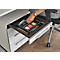 Person opens drawer of white desk container. The drawer contains pens, sticky notes and paper clips.