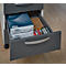 Grey filing cabinet with open drawer filled with paper, envelopes, and office supplies.