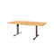 A light brown table with silver legs and a rectangular hole in the middle of the tabletop.