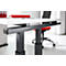Close-up of the black metal frame of a height-adjustable desk. Desk top white, office chair red.