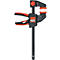 Une serre-joint Bessey noire et rouge. La serre-joint a une poignée rouge et des mâchoires de serrage.