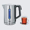 Stainless steel kettle with blue illuminated water level indicator and a cup of tea.