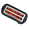 Un grille-pain noir vu de dessus. À l'intérieur, les serpentins chauffants brillent en rouge.