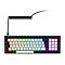 Kompakte Gaming-Tastatur mit RGB-Beleuchtung, weißen und schwarzen Tasten sowie einem Spiralkabel.