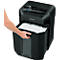 A person opening a black paper shredder drawer filled with shredded paper. The "Fellowes" logo is visible.