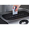 A hand is inserting a Eurocard into a shredder.