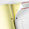 A yellow notepad with perforated pages. A page is turned over, revealing a white page with lines and red stripes.
