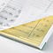Close-up of an open order book. The pages show handwritten entries of items and prices. The page is partially yellow.