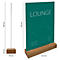 A table card with a wooden base. The green sign says "LOUNGE". The sign is 325 mm high and stands on a 210 mm wide wooden base.