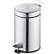 Round silver trash can with lid and foot pedal.