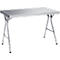 Silver folding table with metal legs against a white background.