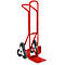 Red stair climber against a white background. The handle is bent, three small wheels per side.
