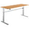 Height-adjustable wooden desk with silver metal legs against a white background.