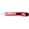 A red utility knife lies horizontally. The blade is silver, the handle red with a black element for blade adjustment.