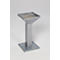 Gray metal urn on square base. Top bowl is square with a handle.