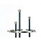 Modern coat rack with round, silver-colored knobs. Three tall, black rods, crowned with silver-colored balls, stand on a silver ring.